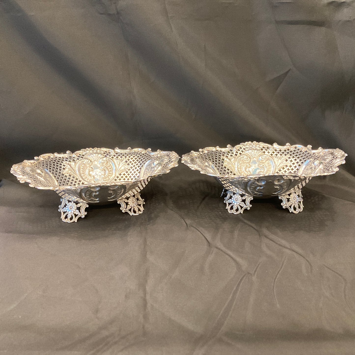 An Antique pair of pierced silver bonbon dishes