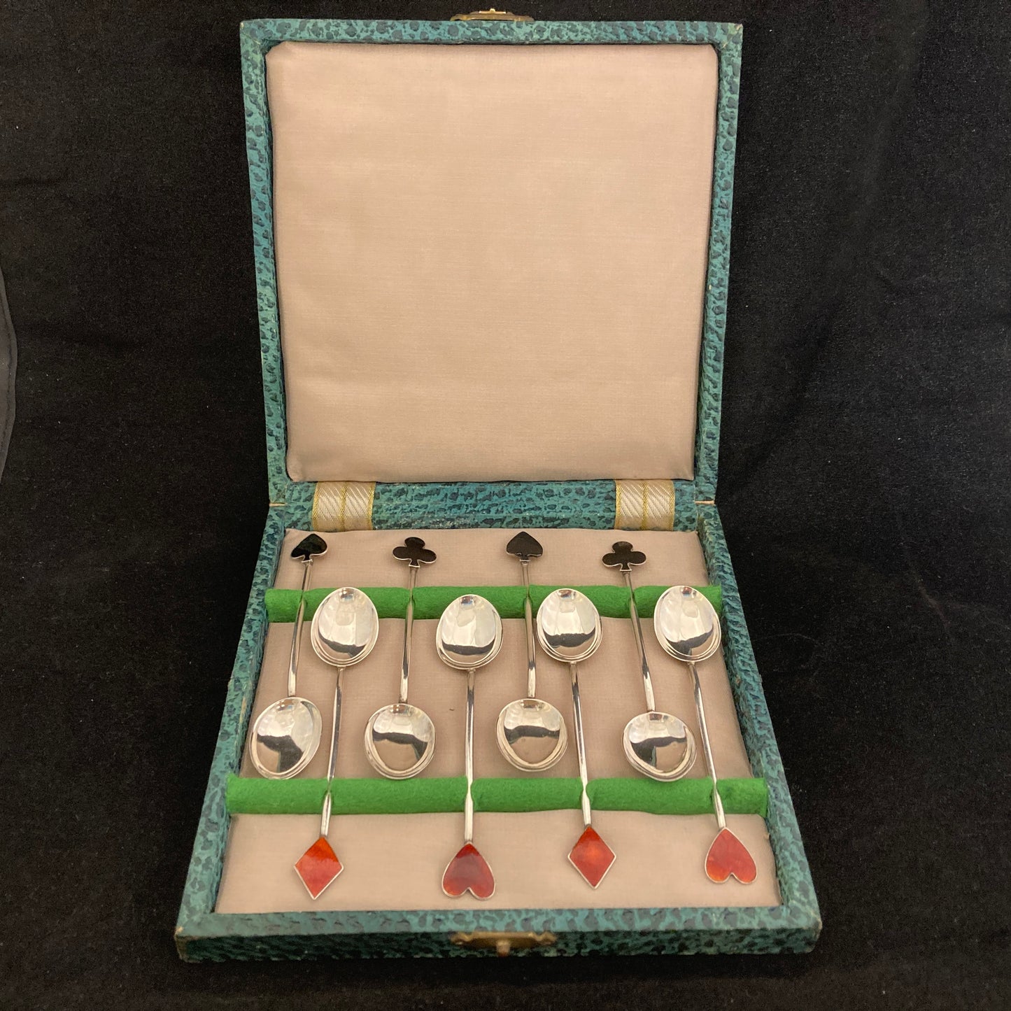 Boxed set of 8 silver and enamel spoons with Playing card symbols