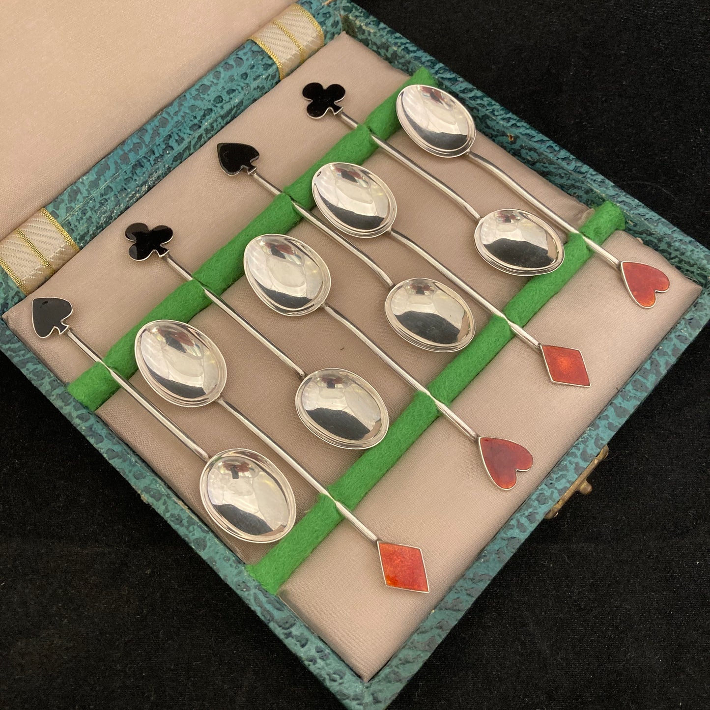 Boxed set of 8 silver and enamel spoons with Playing card symbols