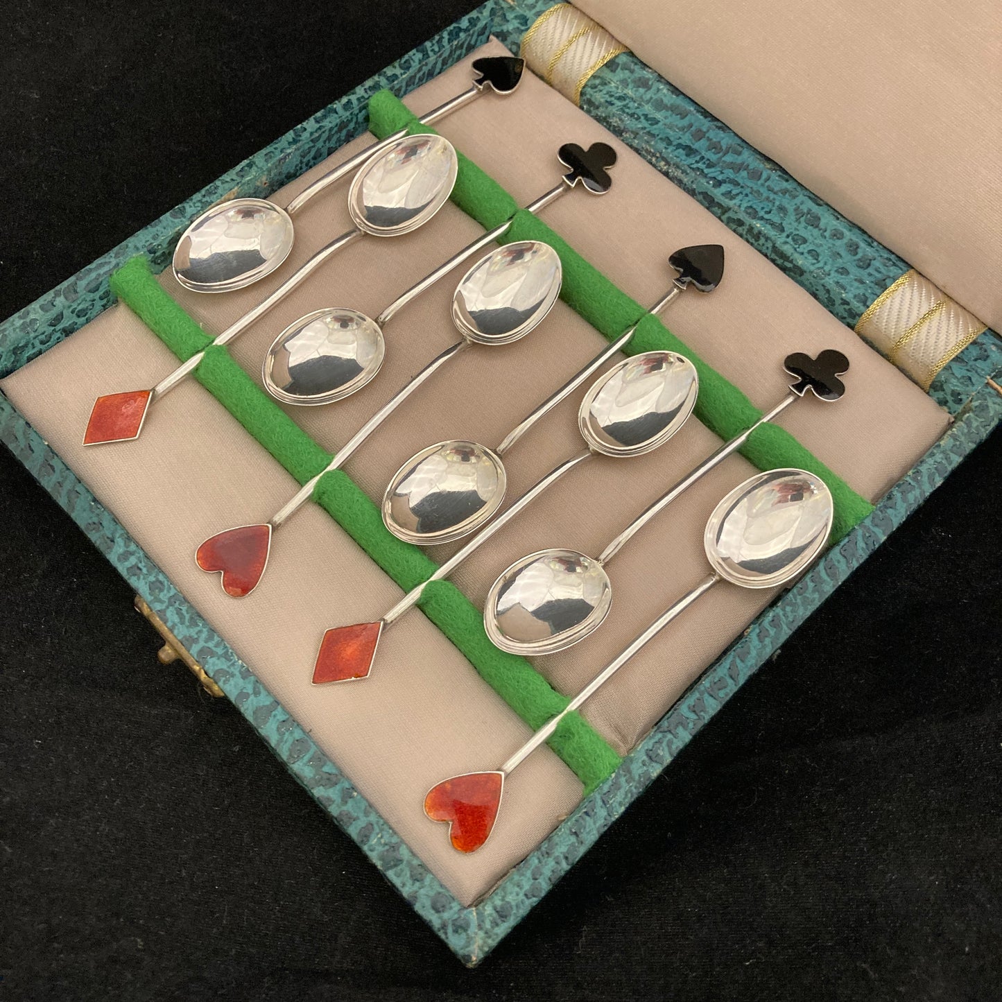 Boxed set of 8 silver and enamel spoons with Playing card symbols