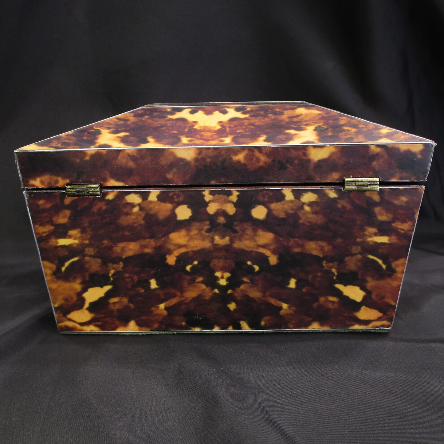 A faux tortoise shell tea caddy