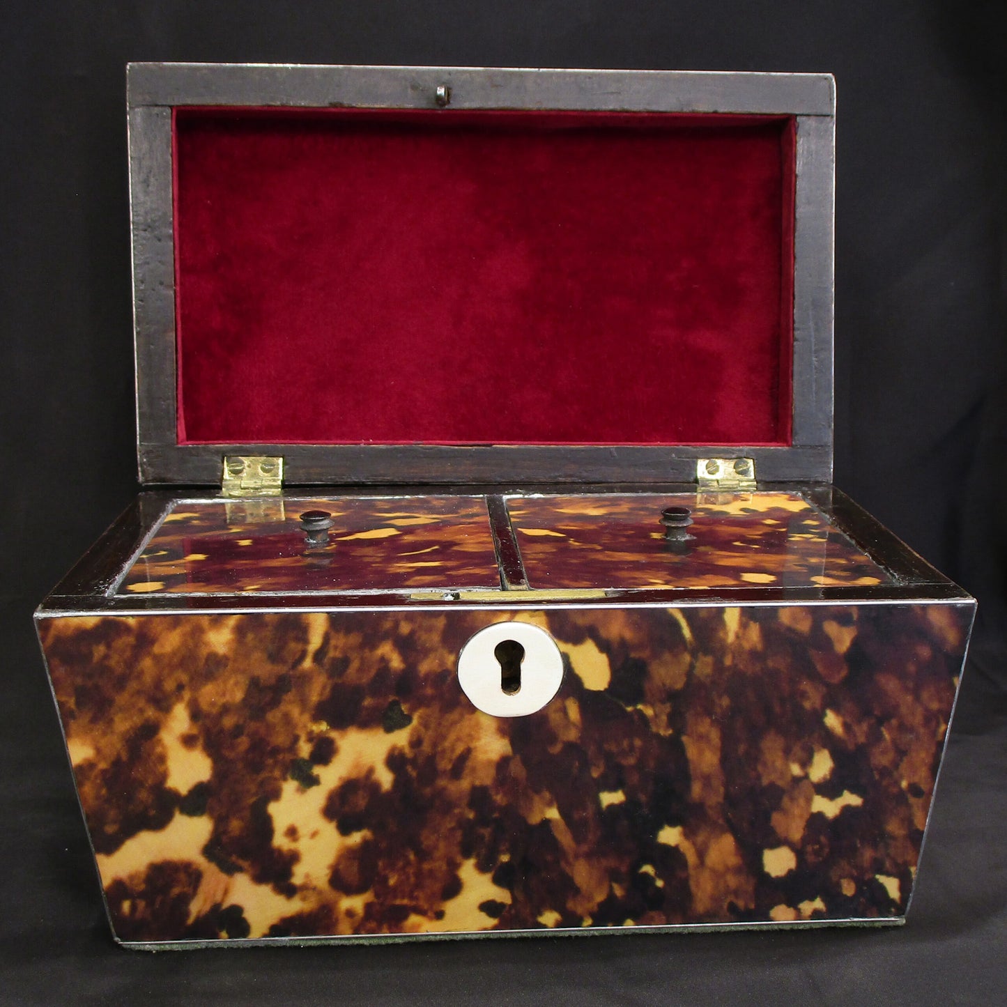 A faux tortoise shell tea caddy