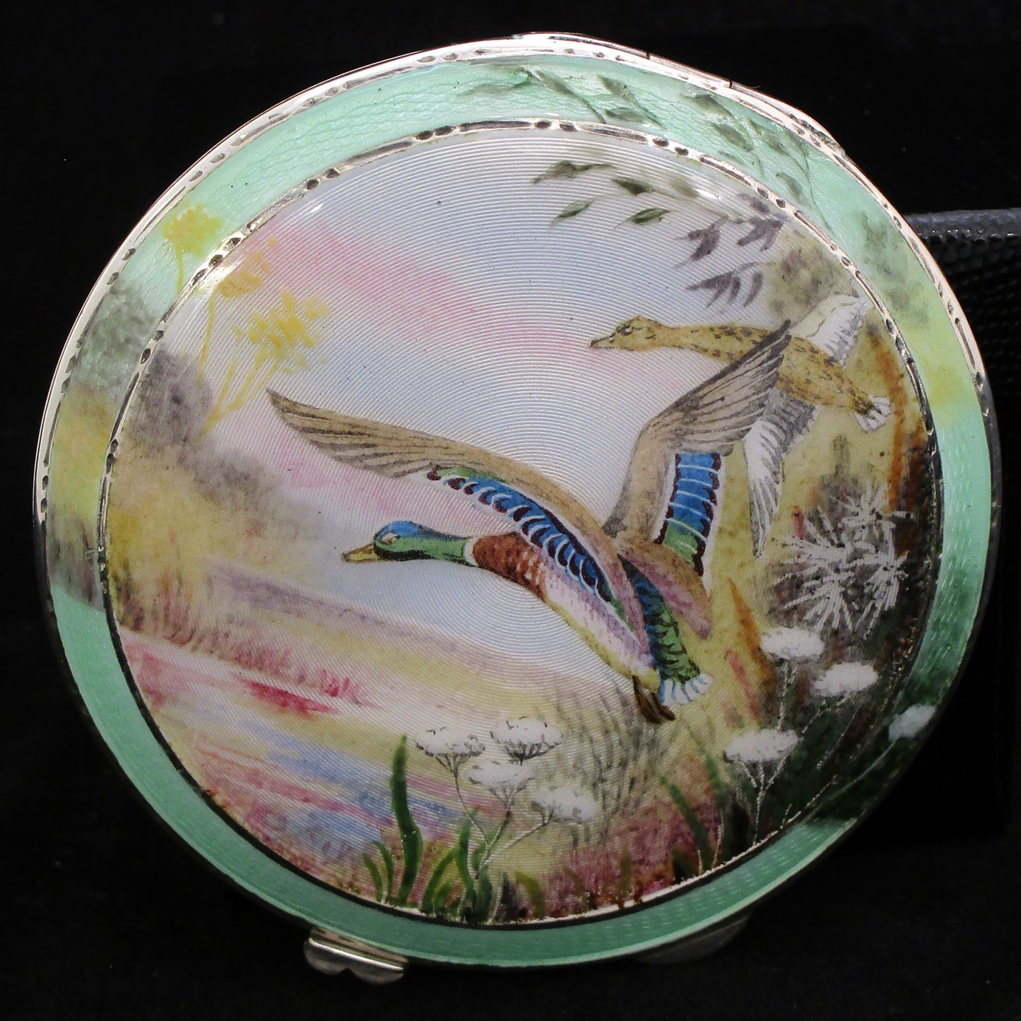 Silver and enamel compact with hand painted ducks.