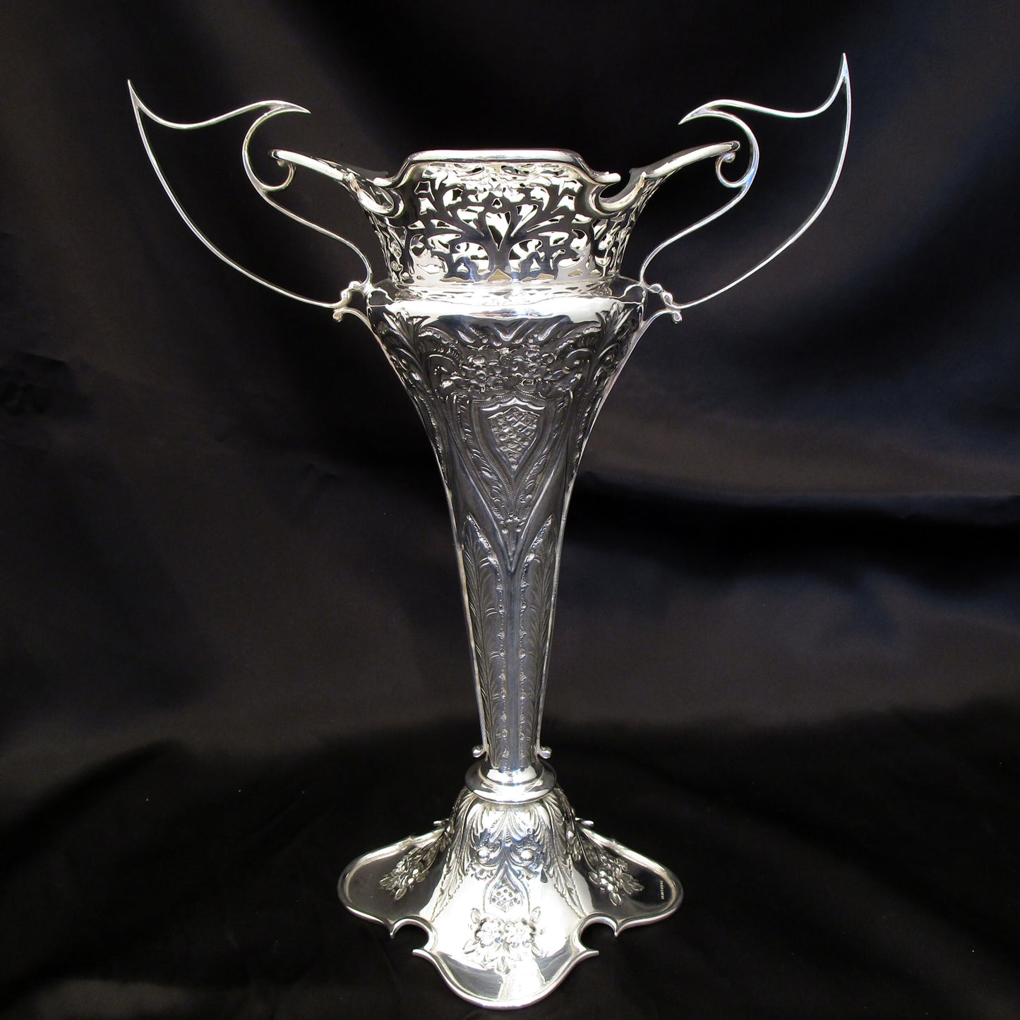 A pair of large sterling silver pierced and embossed vases by Walker & Hall.