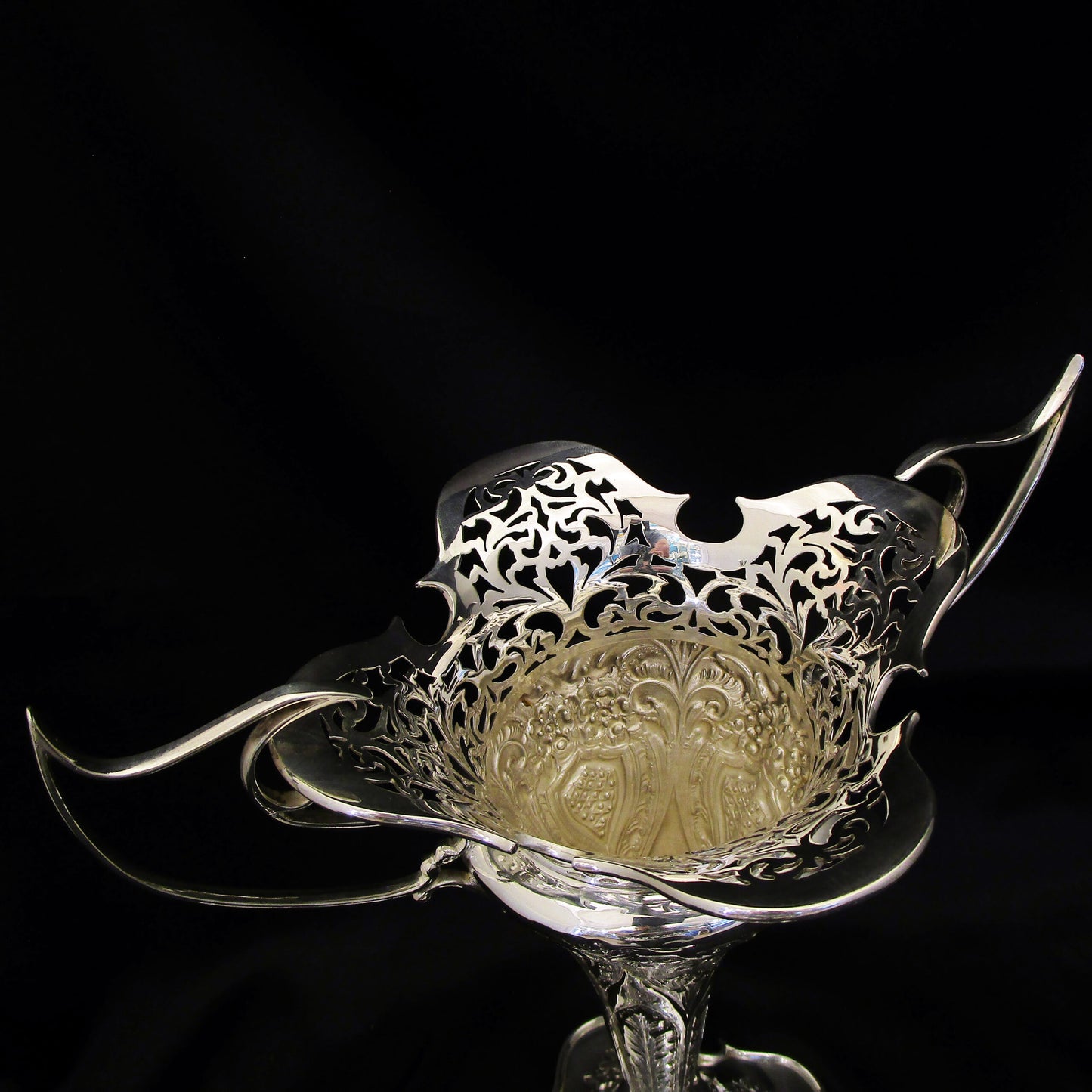 A pair of large sterling silver pierced and embossed vases by Walker & Hall.