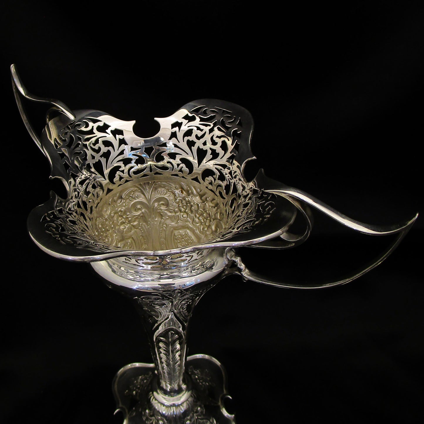 A pair of large sterling silver pierced and embossed vases by Walker & Hall.