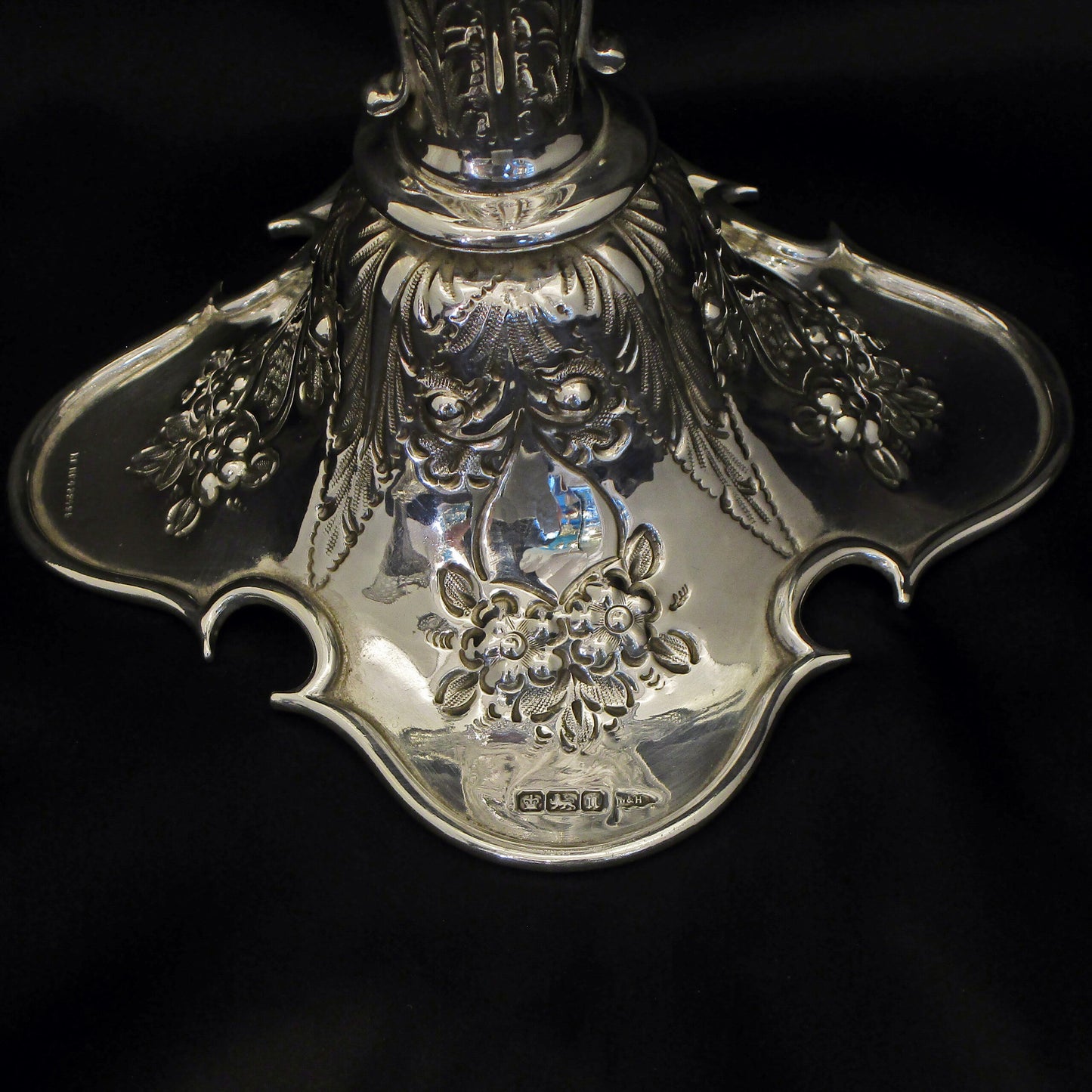 A pair of large sterling silver pierced and embossed vases by Walker & Hall.