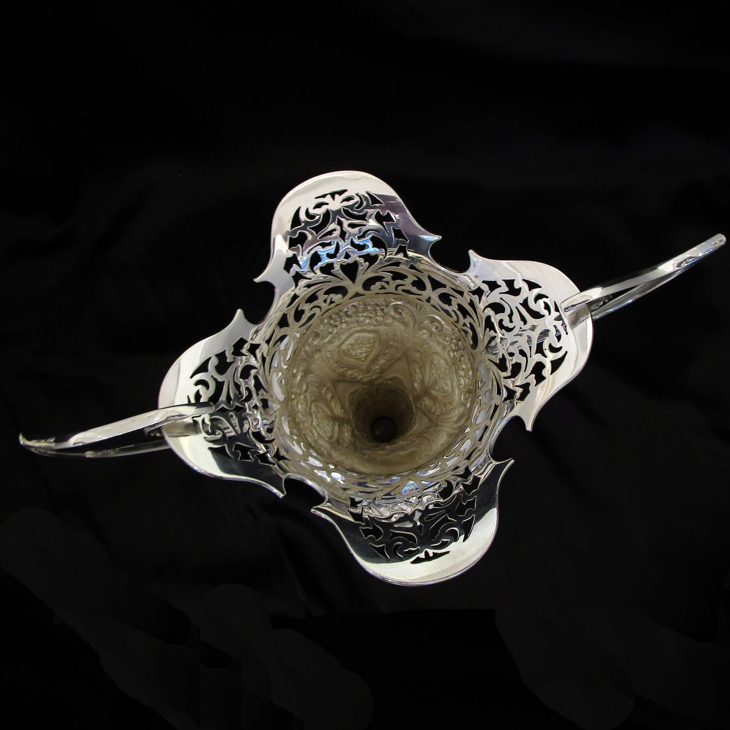 A pair of large sterling silver pierced and embossed vases by Walker & Hall.