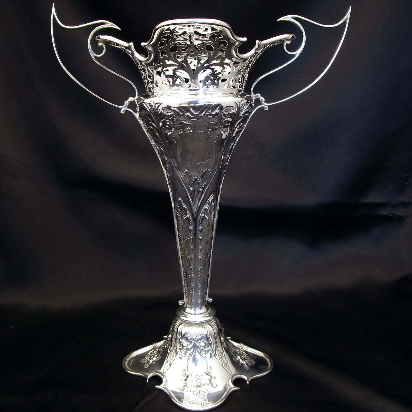 A pair of large sterling silver pierced and embossed vases by Walker & Hall.