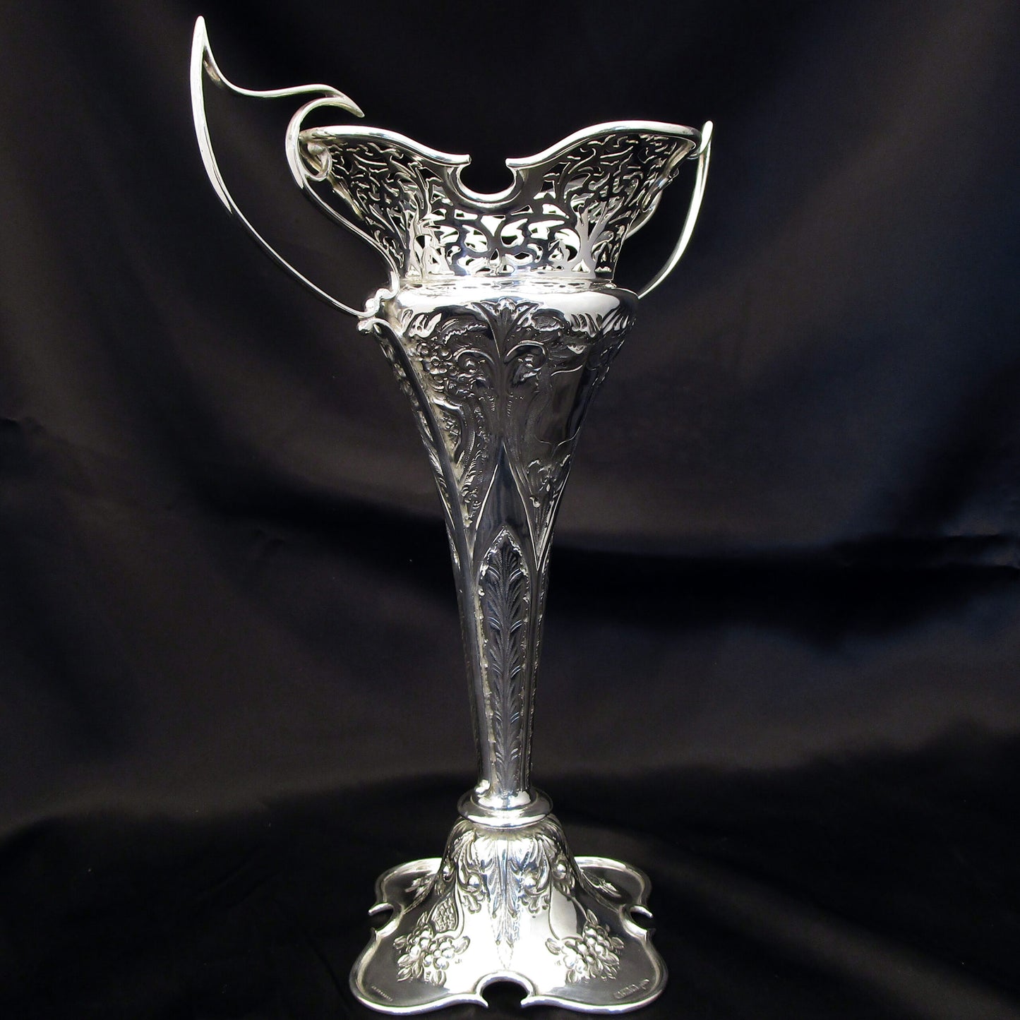 A pair of large sterling silver pierced and embossed vases by Walker & Hall.