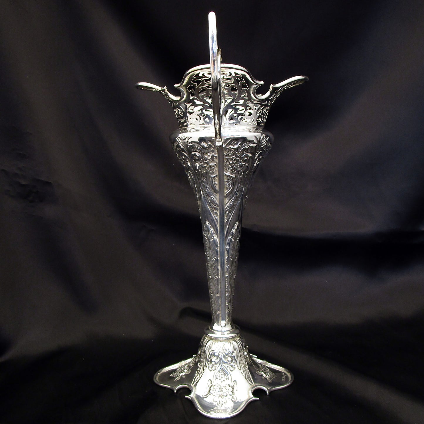 A pair of large sterling silver pierced and embossed vases by Walker & Hall.