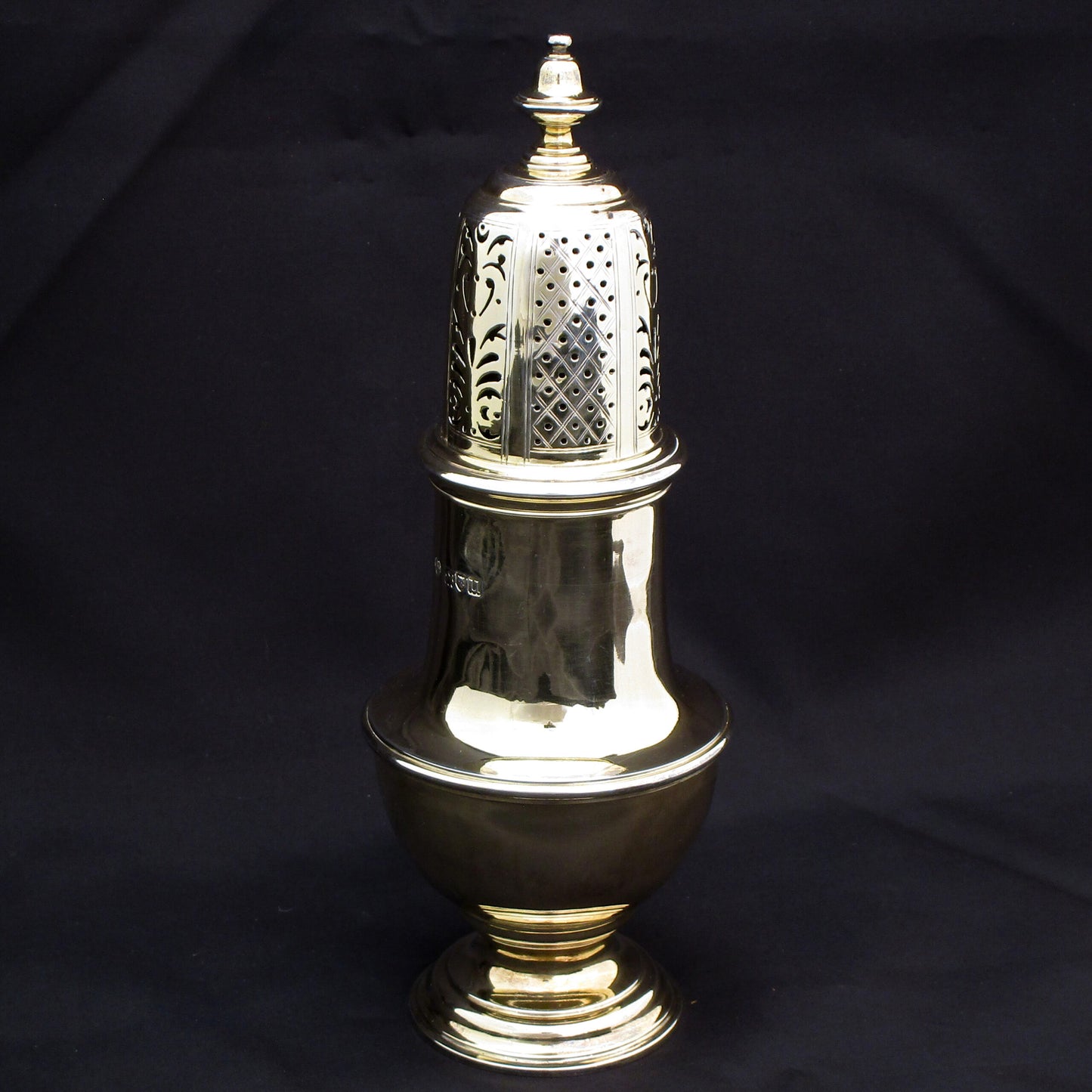 Rare giant gilded sugar shaker.