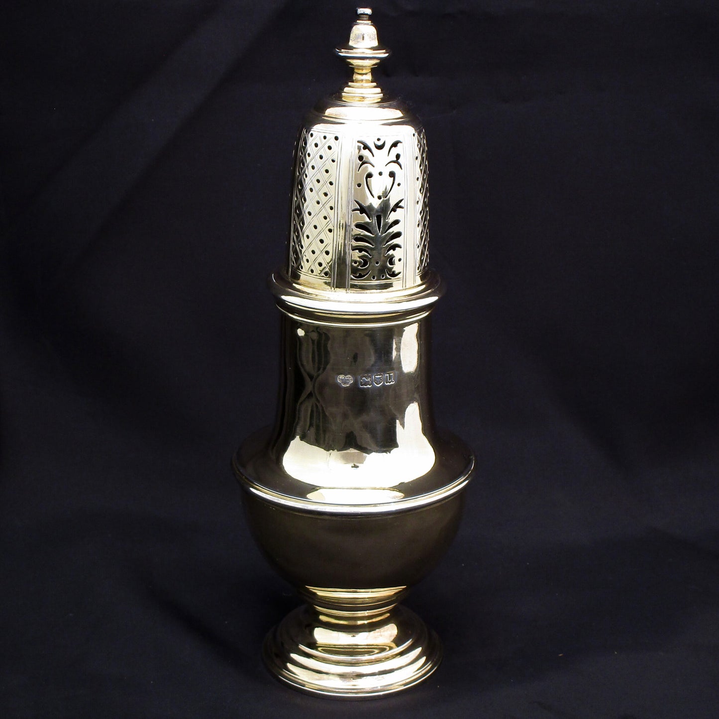 Rare giant gilded sugar shaker.