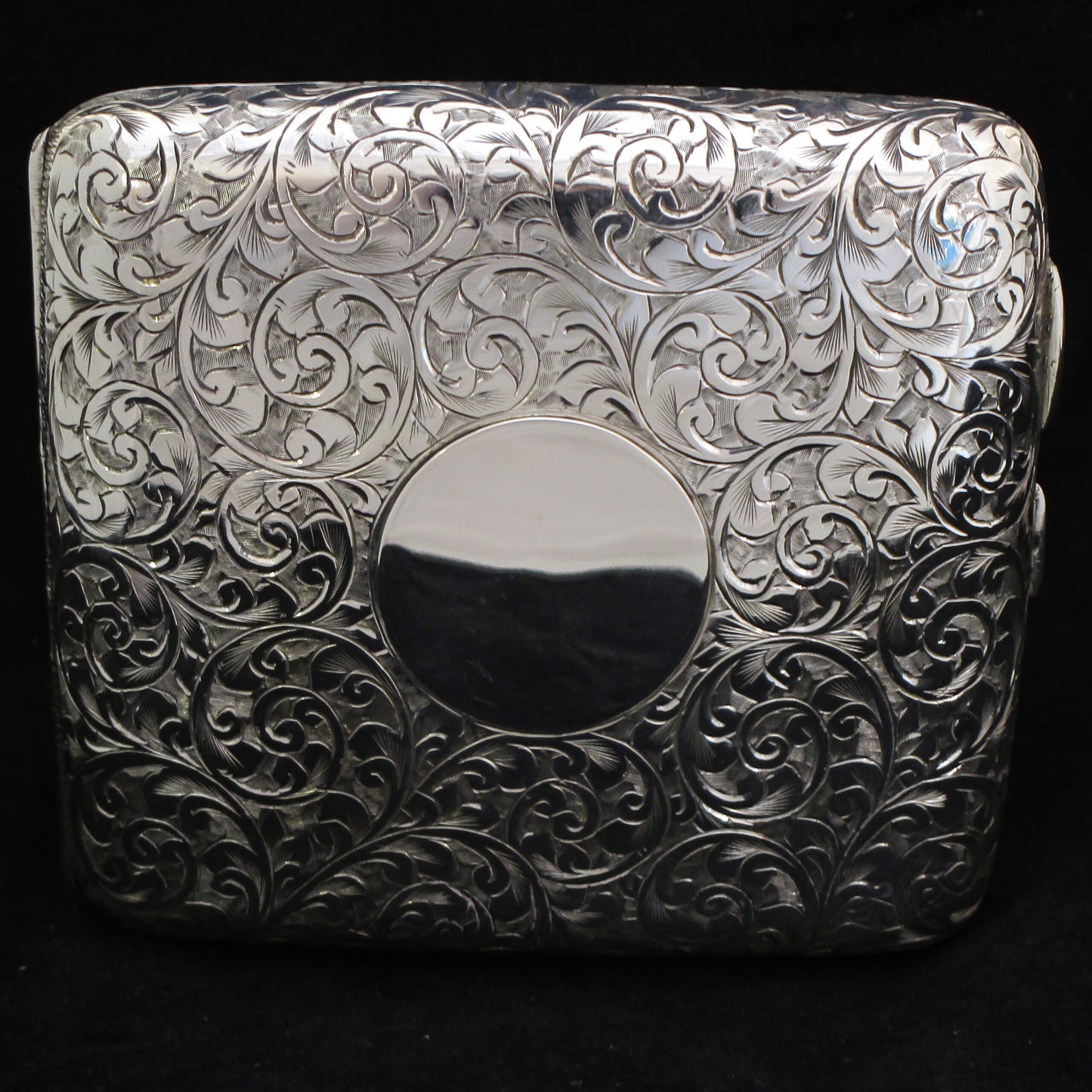 Chased silver cigarette case.