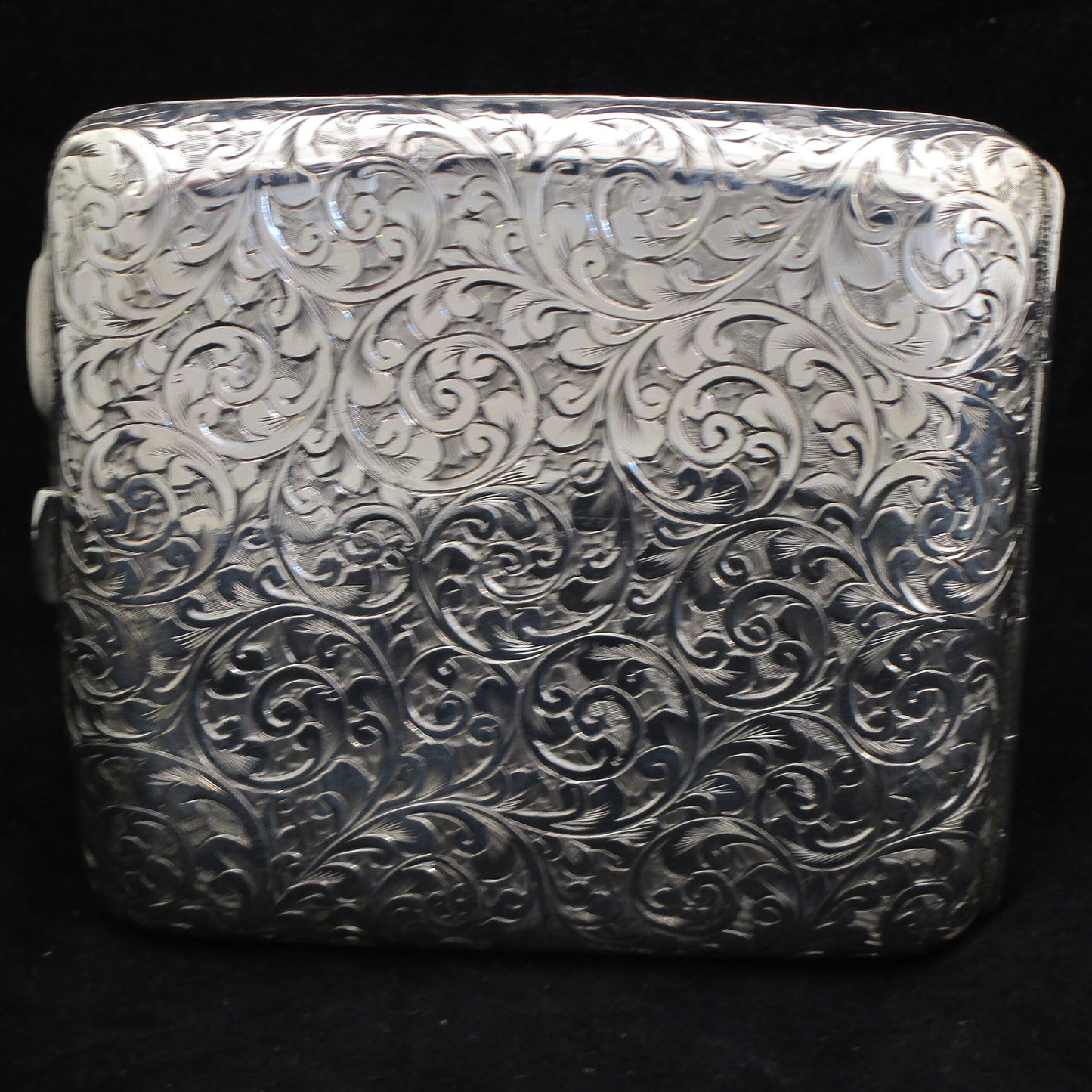 Chased silver cigarette case.