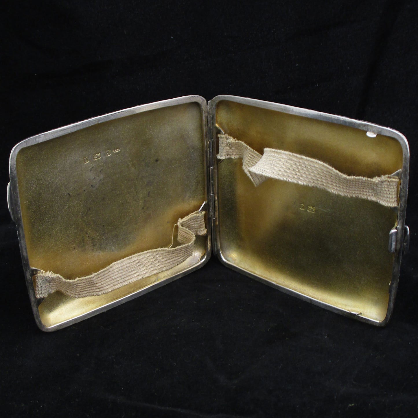 Chased silver cigarette case.