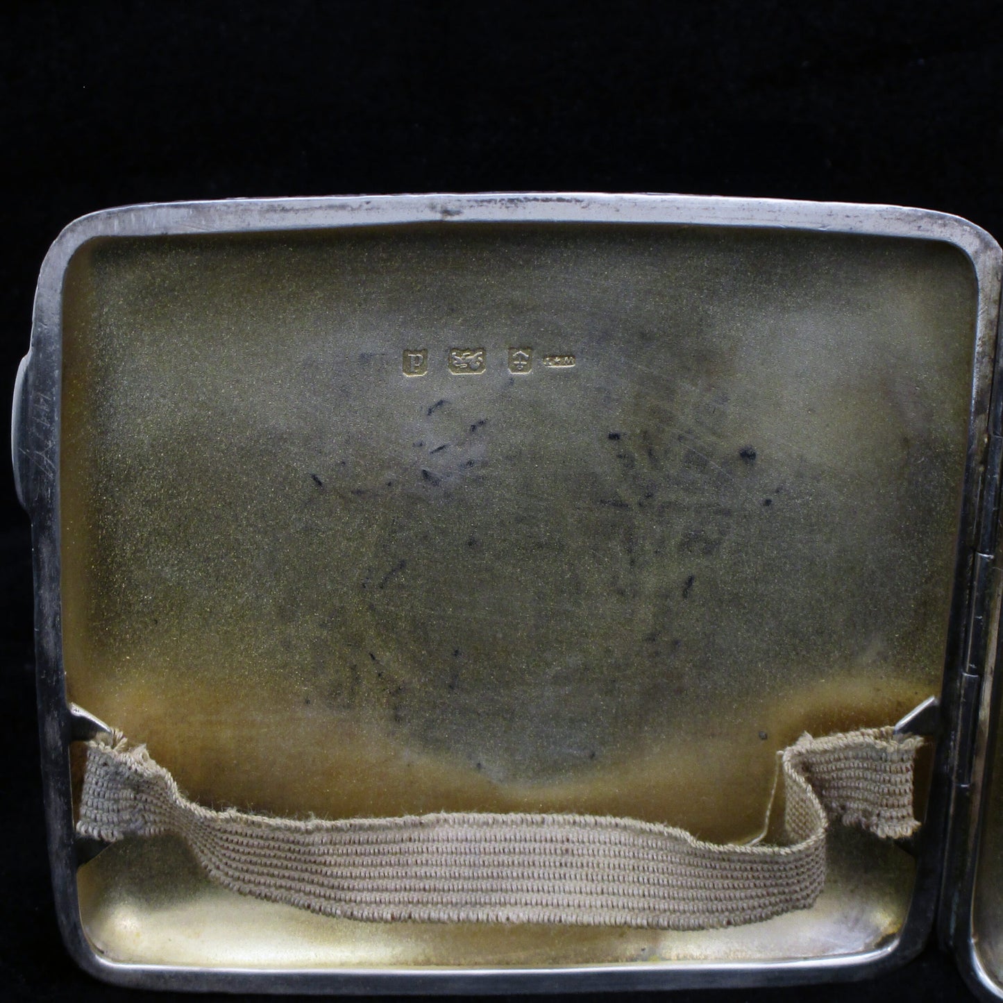 Chased silver cigarette case.