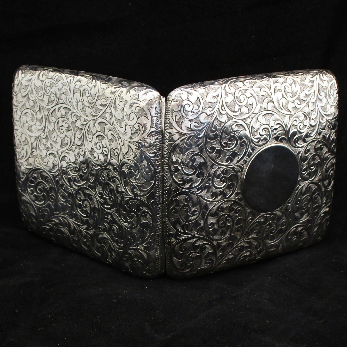 Chased silver cigarette case.