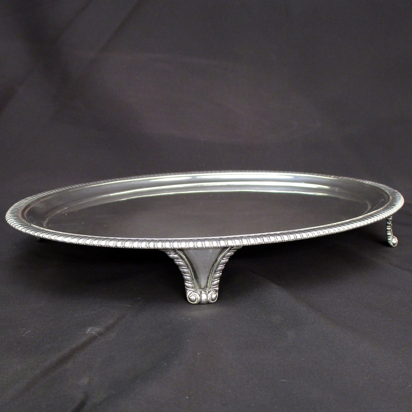 A Georgian oval gadrooned border sterling silver salva / drinks tray.