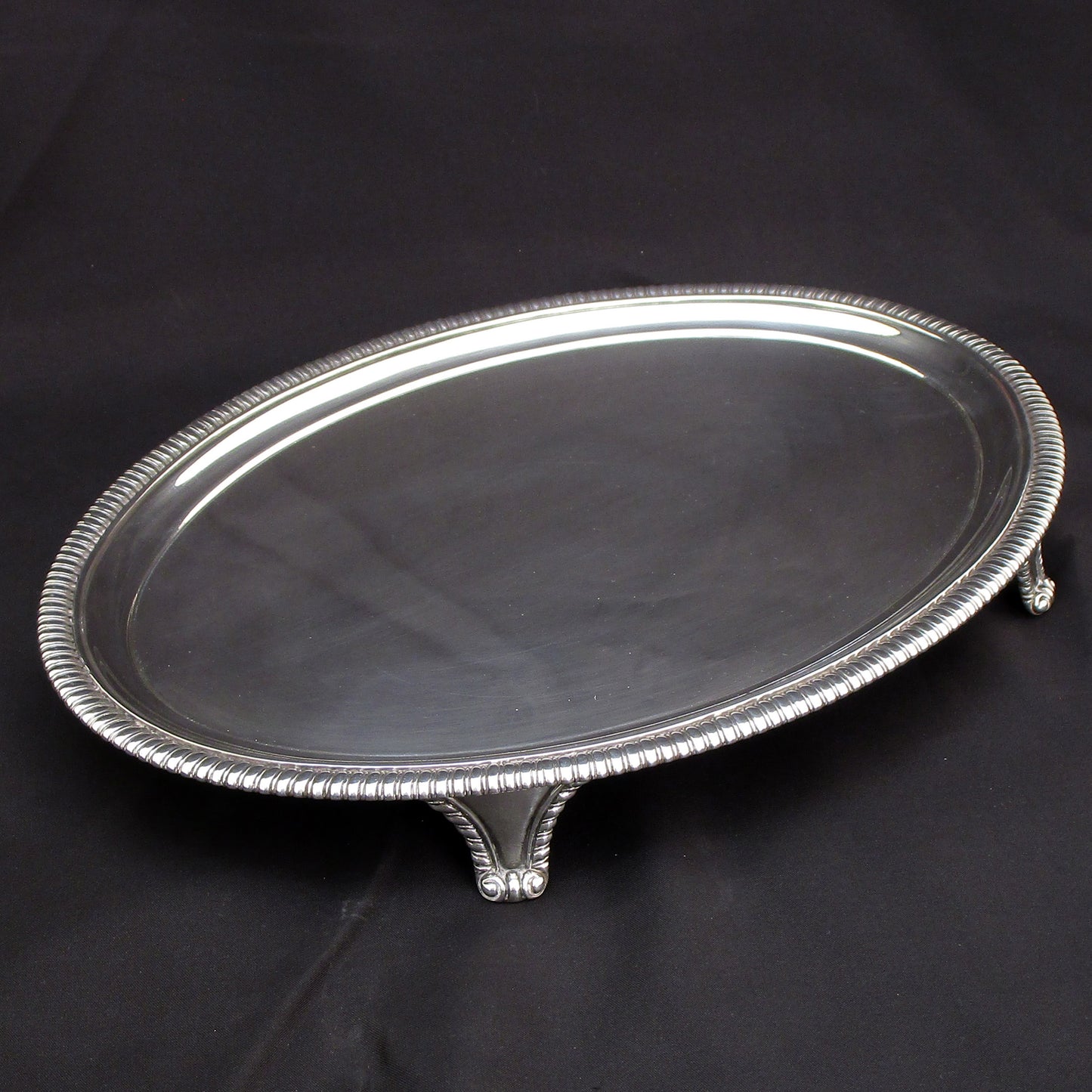 A Georgian oval gadrooned border sterling silver salva / drinks tray.