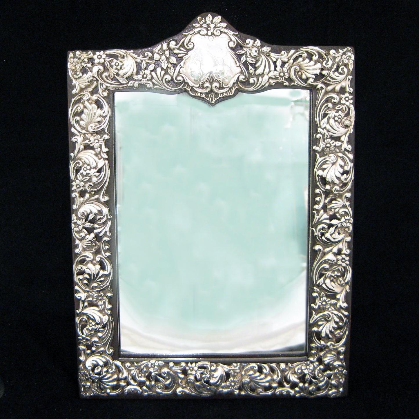 Sterling silver ornate table mirror/picture frame.
