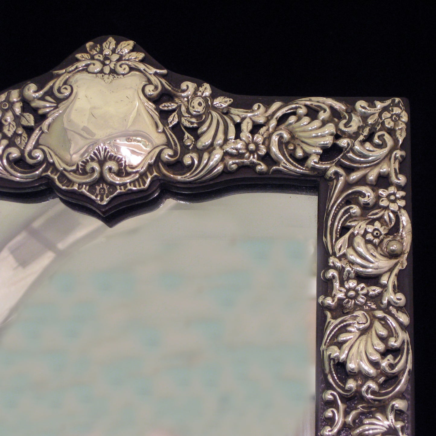 Sterling silver ornate table mirror/picture frame.