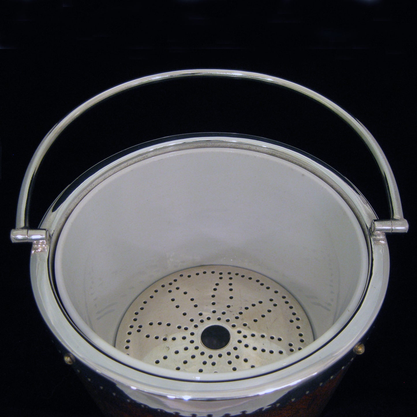 A mahogany ice bucket -cooler