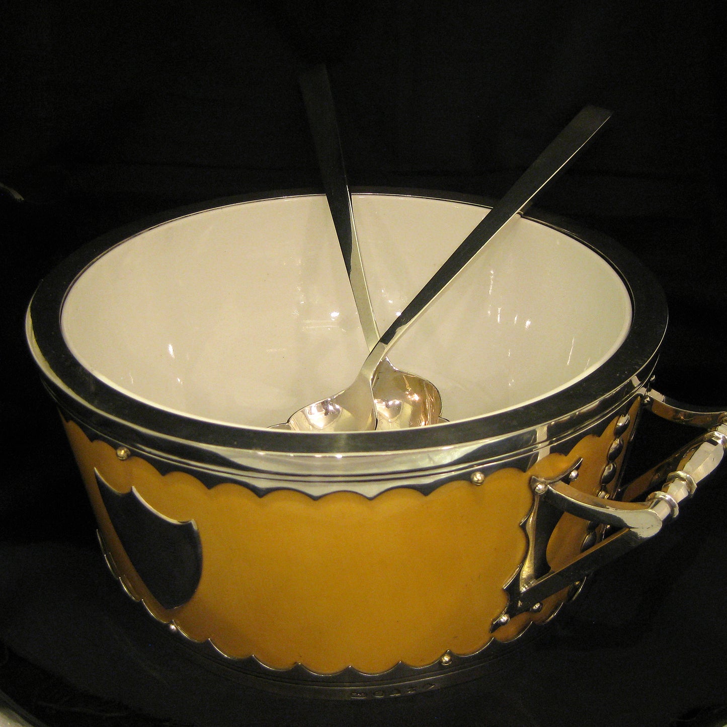 A impressive and unique salad bowl with servers.