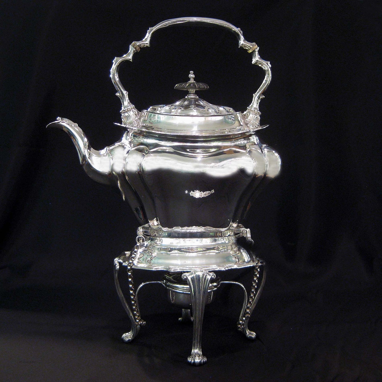 Silver kettle on stand by Walker & Hall