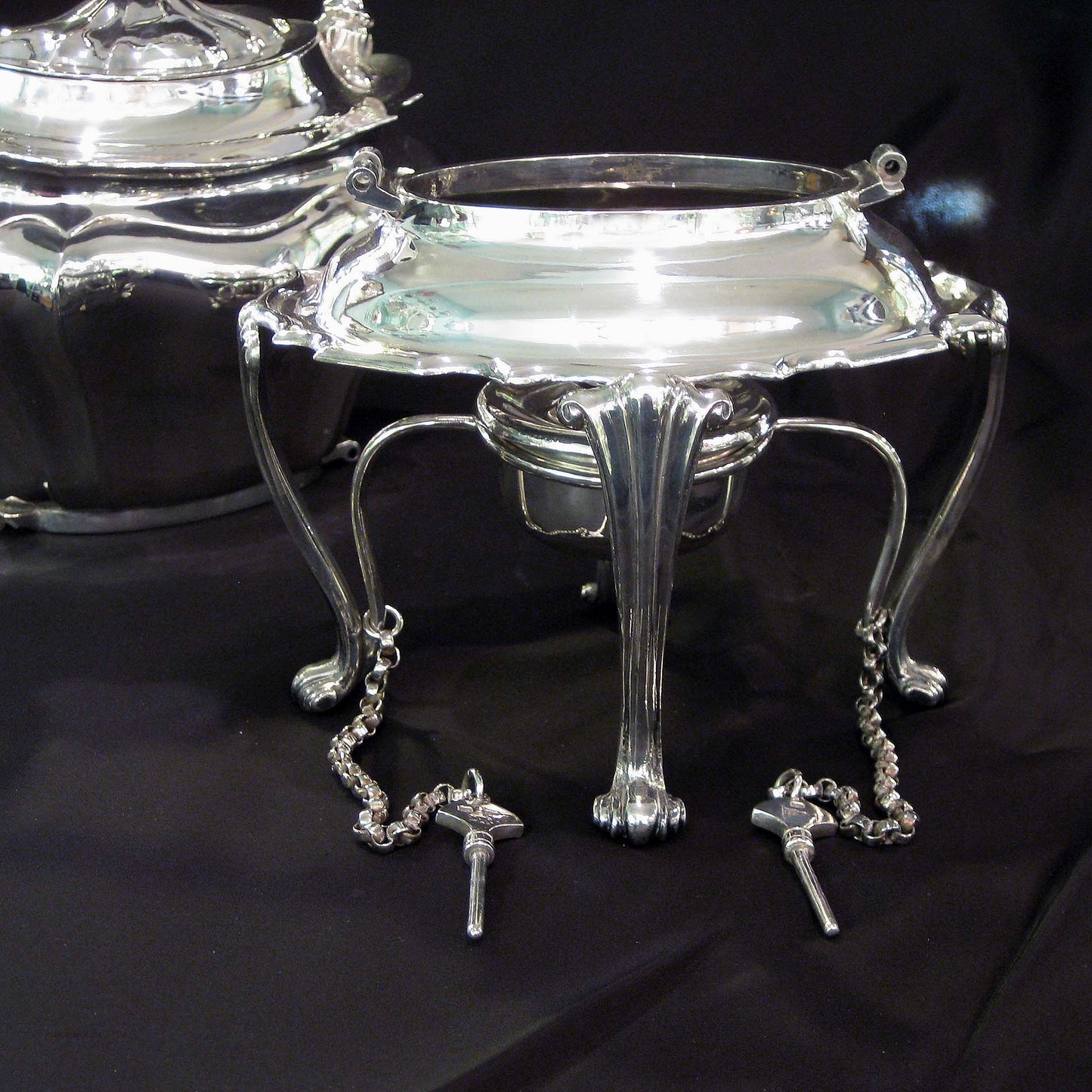 Silver kettle on stand by Walker & Hall