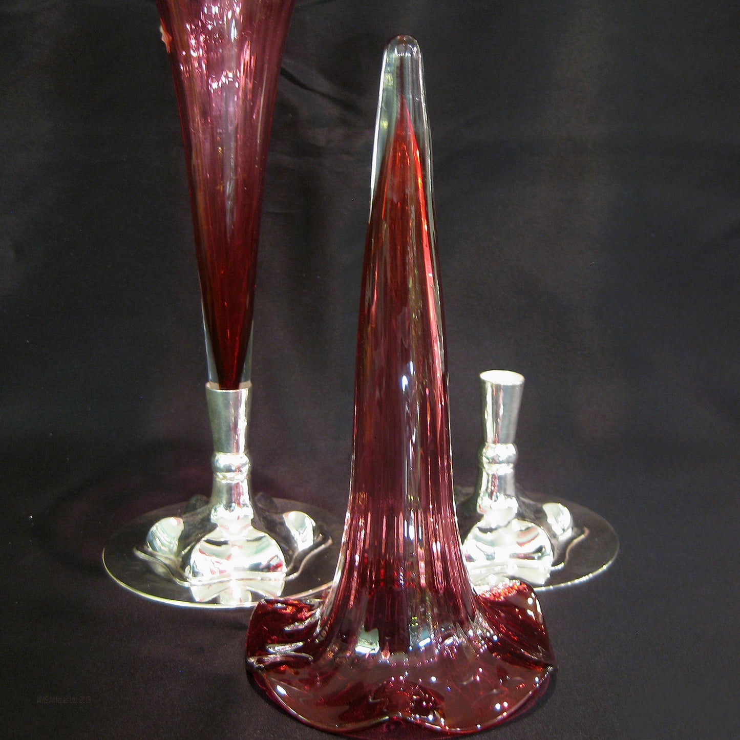 A pair of cranberry bud vases
