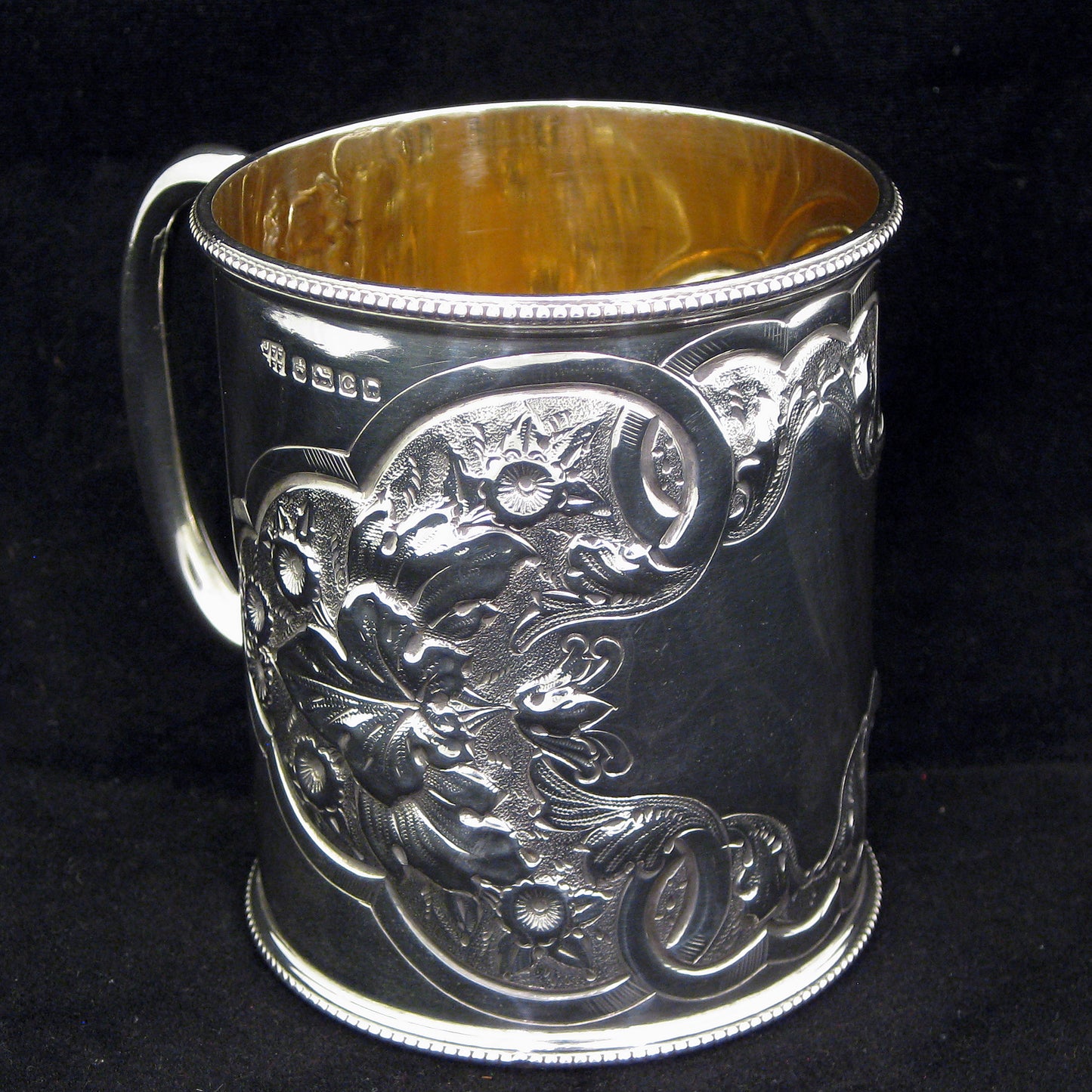 A fine quality silver embossed mug.