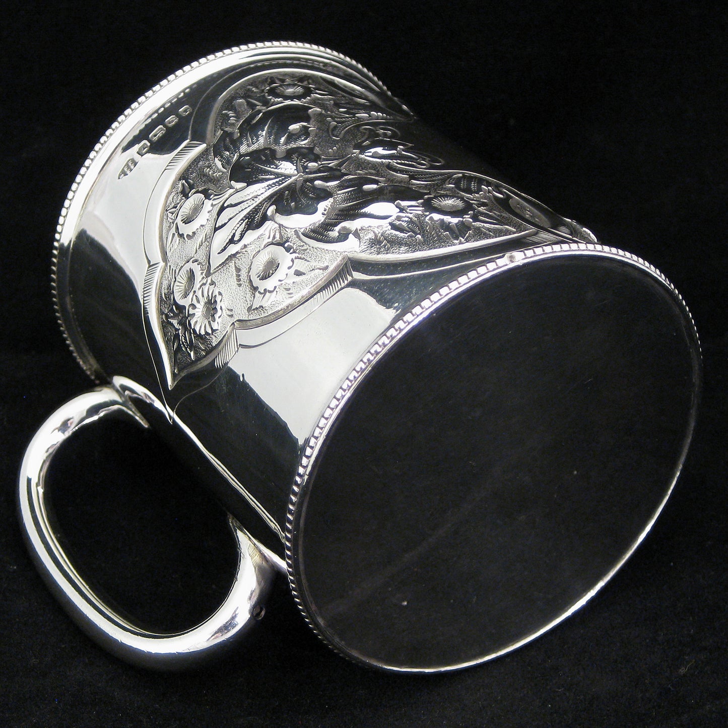 A fine quality silver embossed mug.