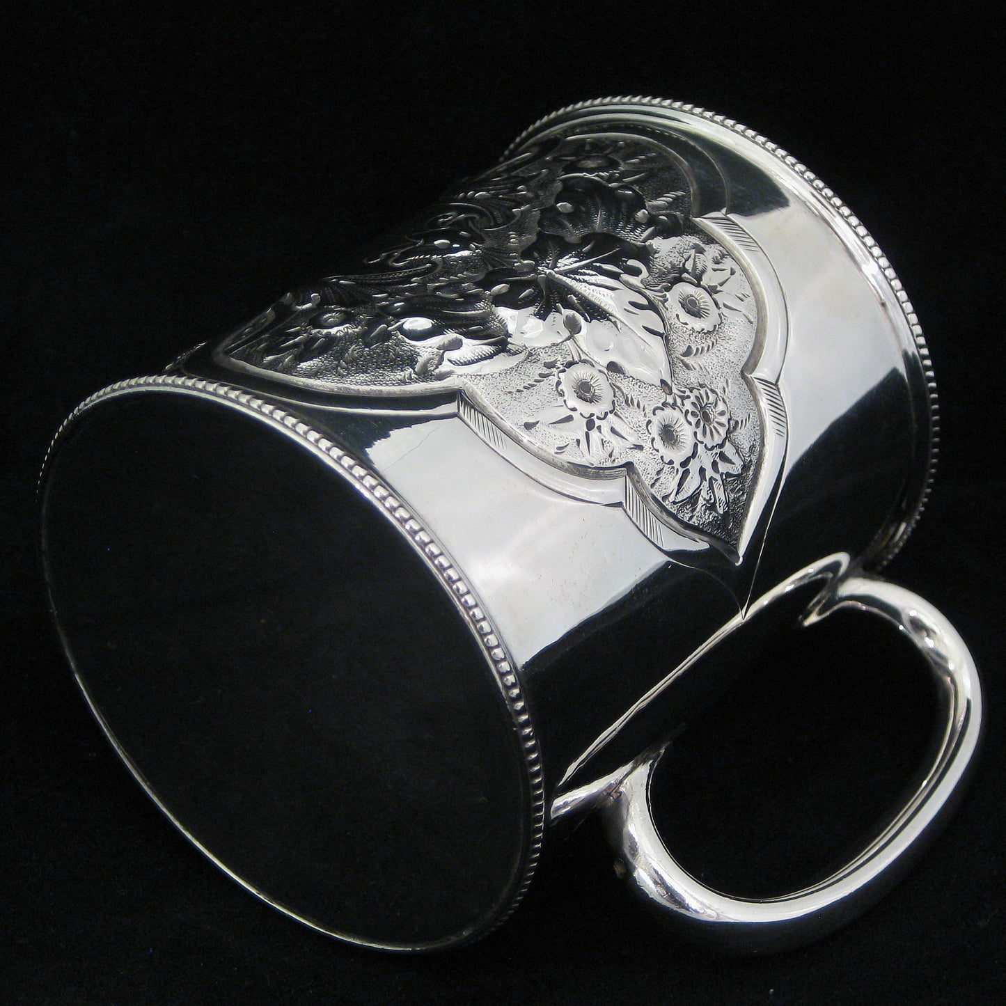A fine quality silver embossed mug.