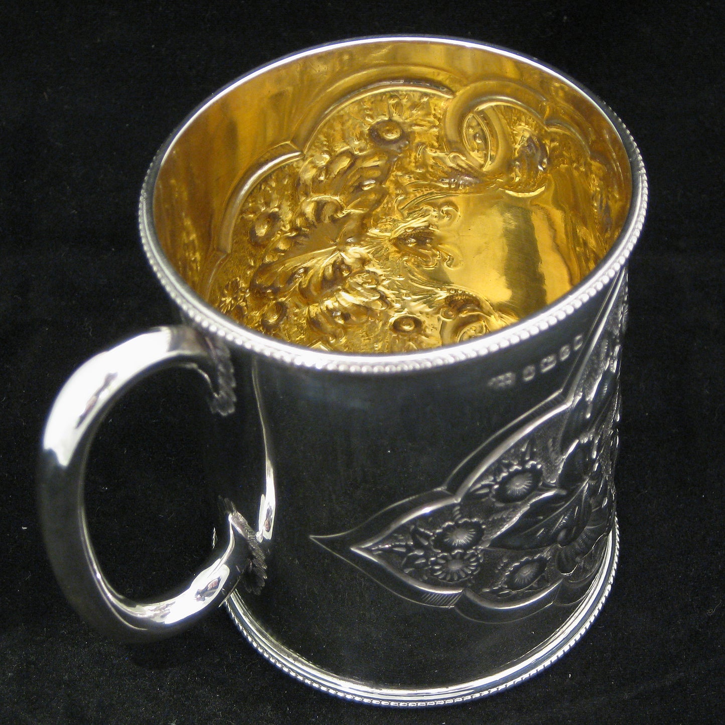 A fine quality silver embossed mug.