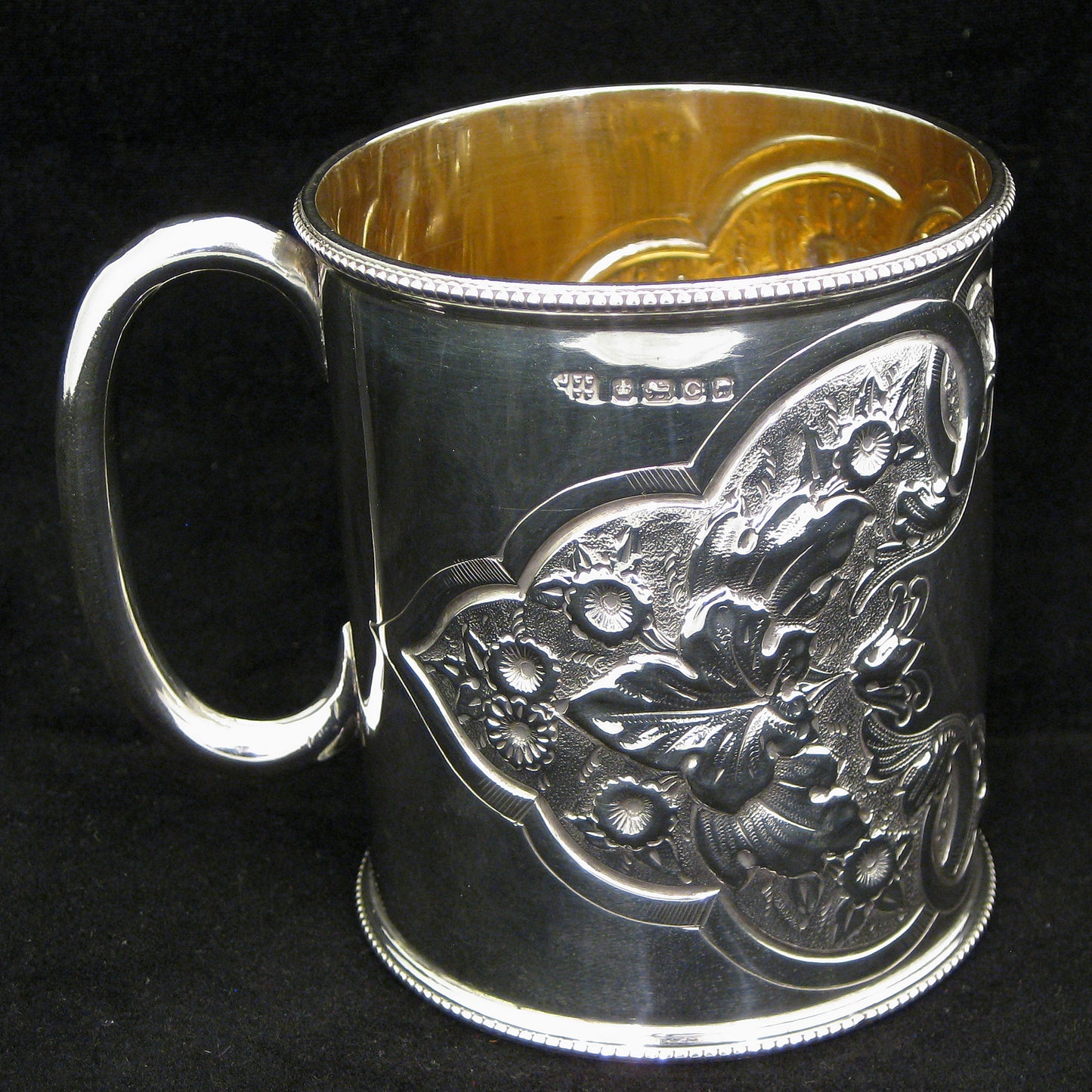 A fine quality silver embossed mug.