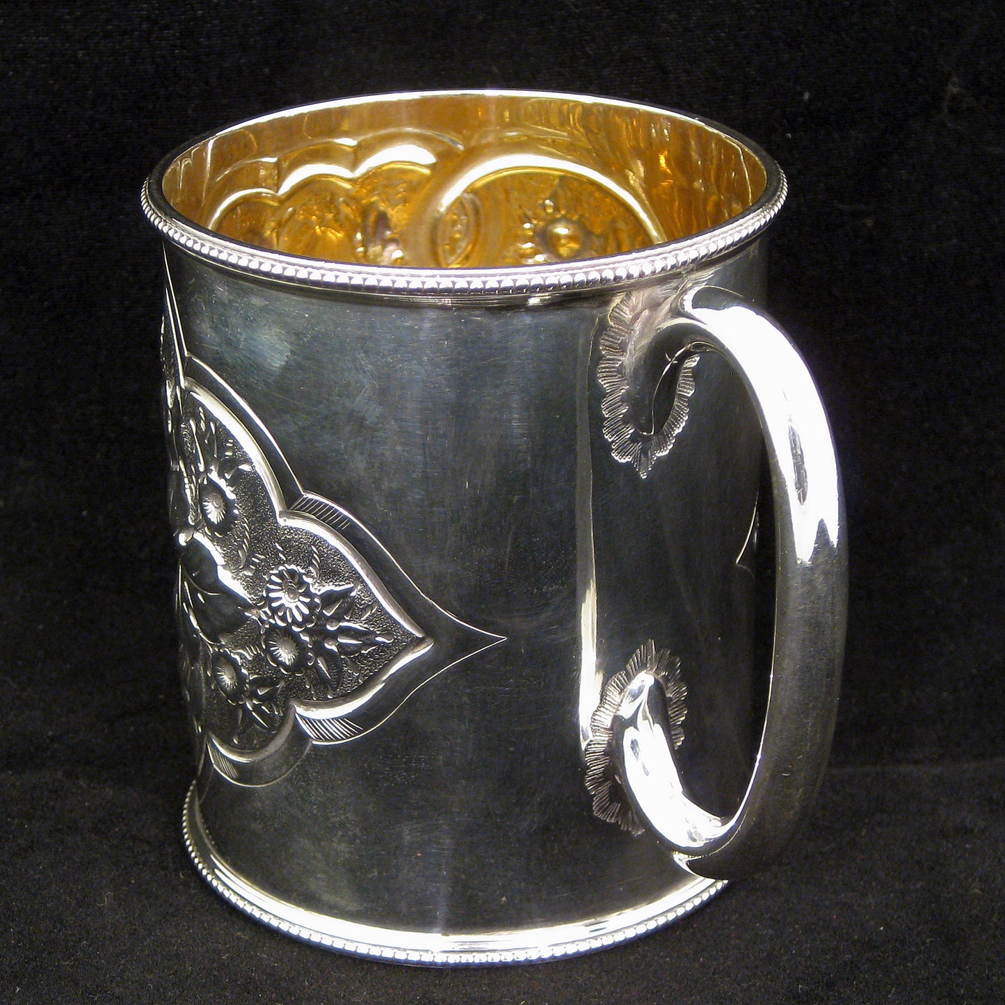 A fine quality silver embossed mug.