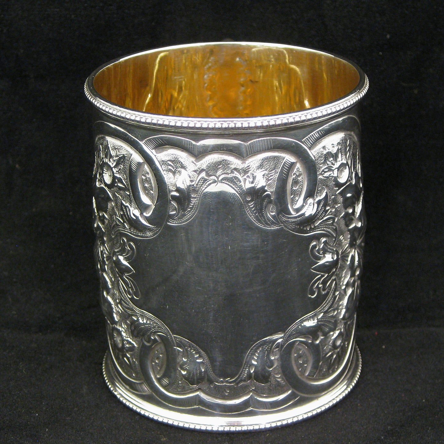 A fine quality silver embossed mug.