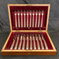 A boxed silver plated 12 place set