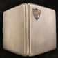 Antique sterling cigarette case with enamel shield