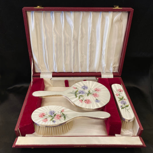 Hand painted silver and enamel boxed dressing table set