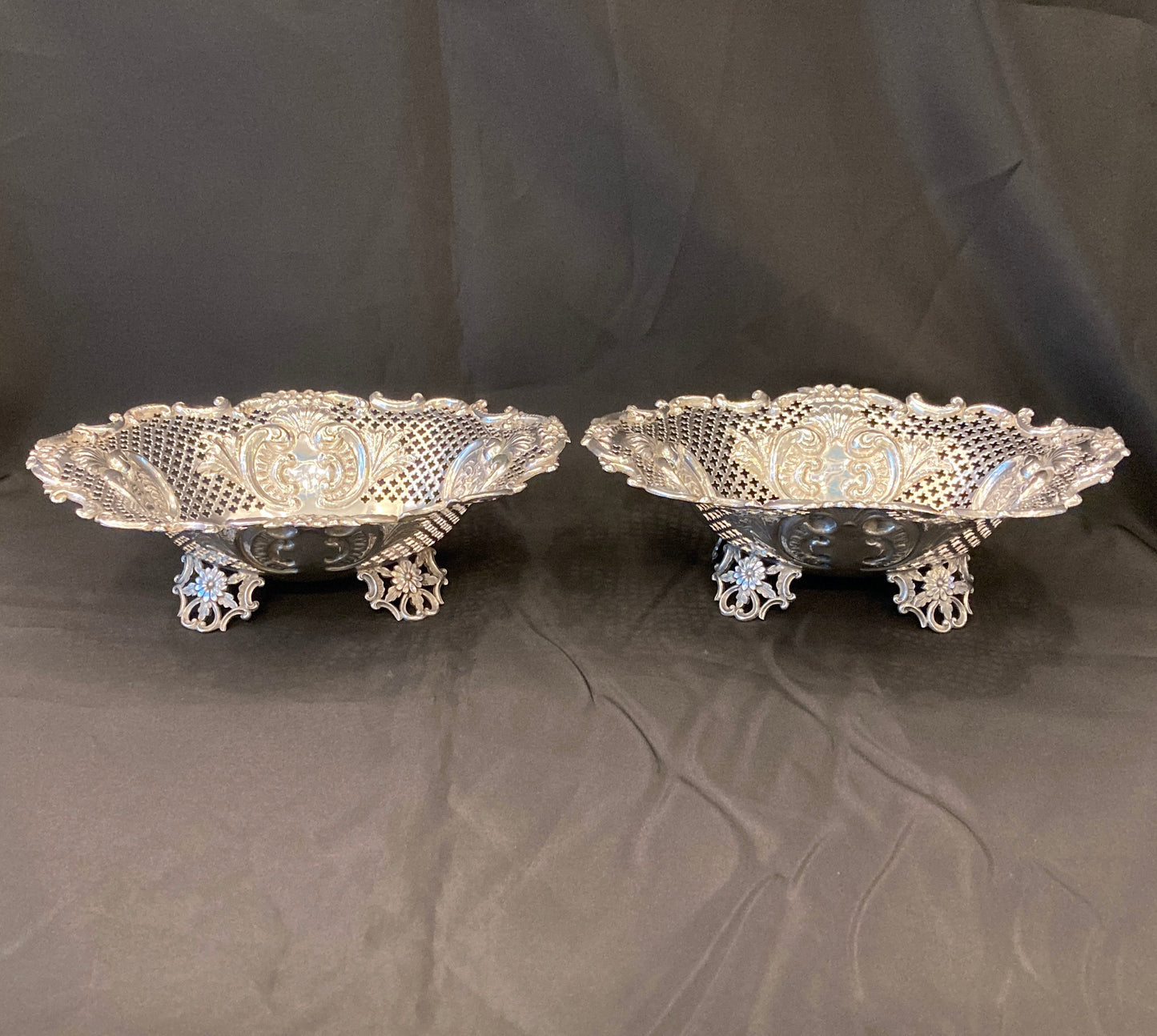 An Antique pair of pierced silver bonbon dishes