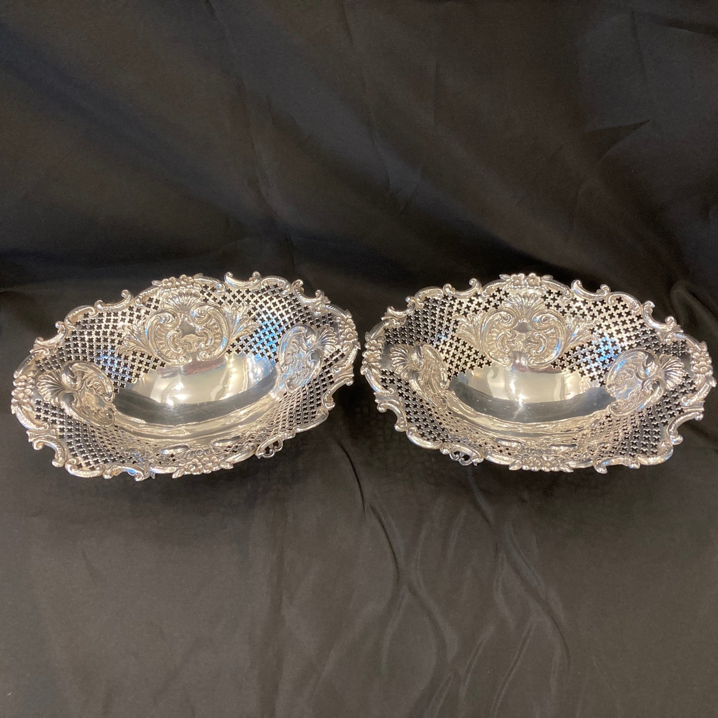 An Antique pair of pierced silver bonbon dishes