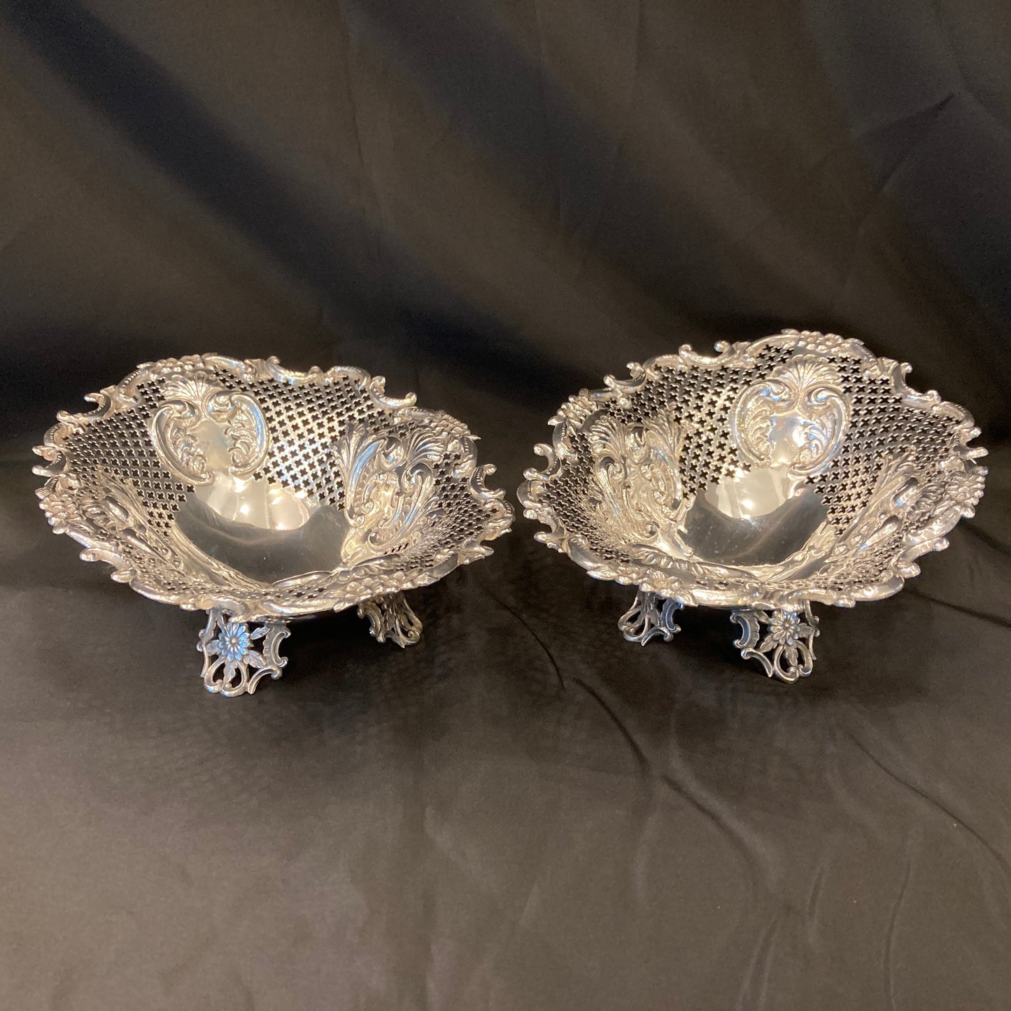 An Antique pair of pierced silver bonbon dishes