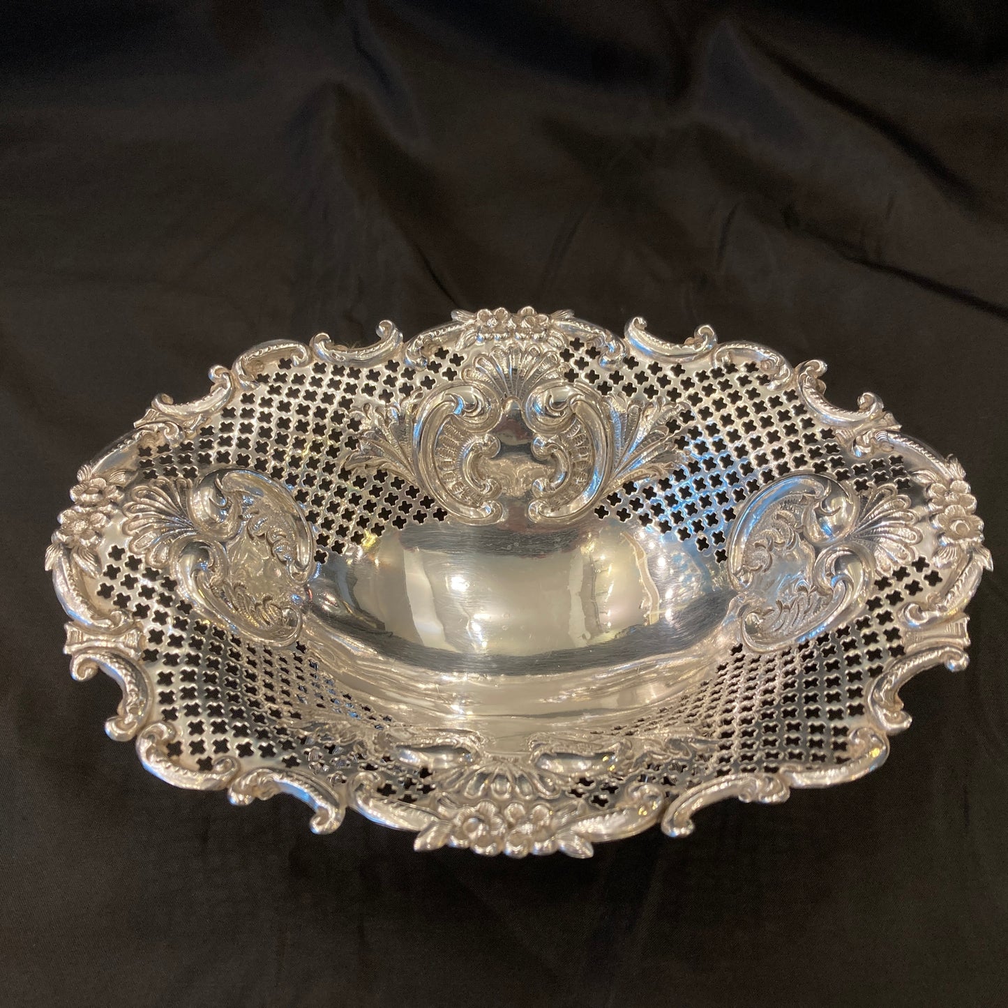 An Antique pair of pierced silver bonbon dishes