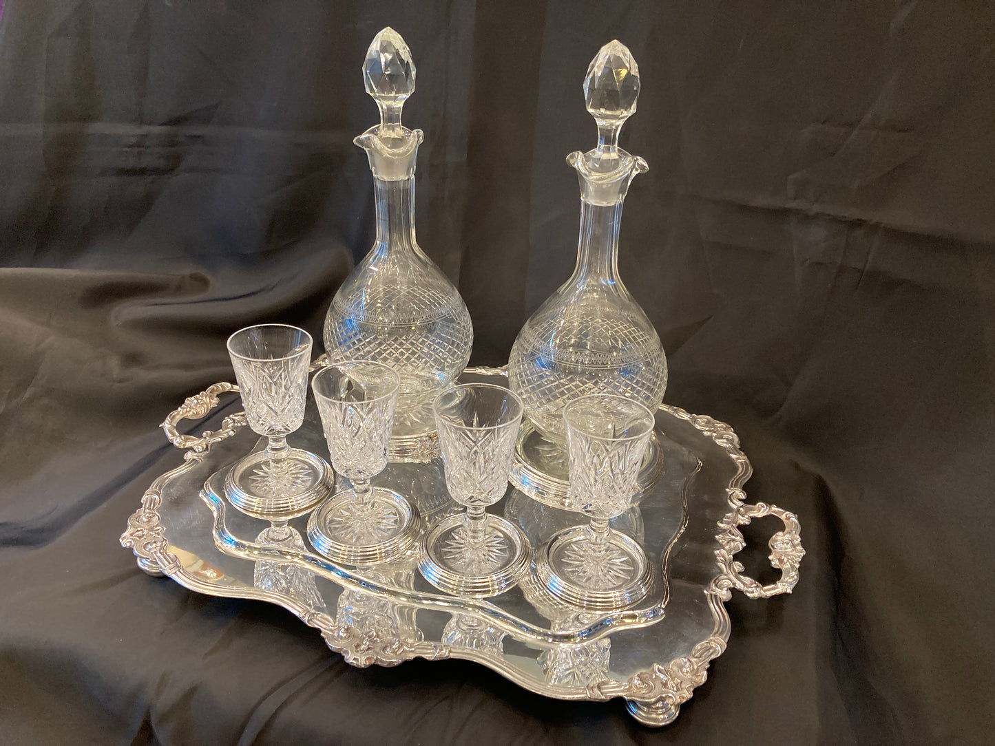 Antique silver plated drinks tray with cut crystal bottles and glasses