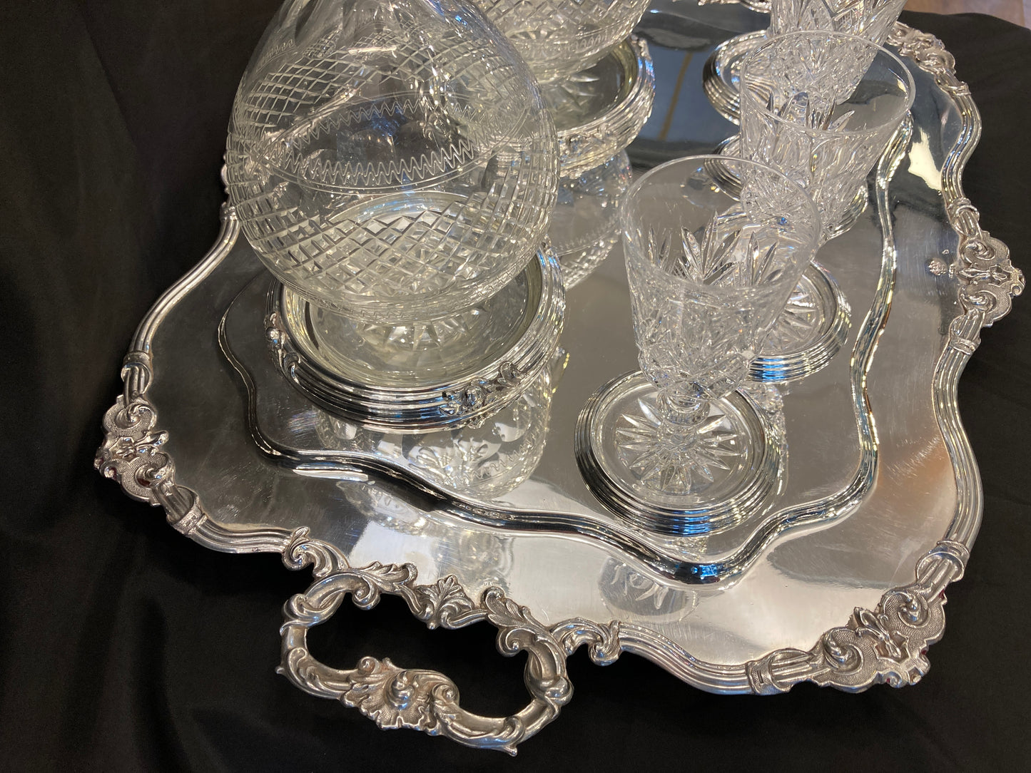 Antique silver plated drinks tray with cut crystal bottles and glasses