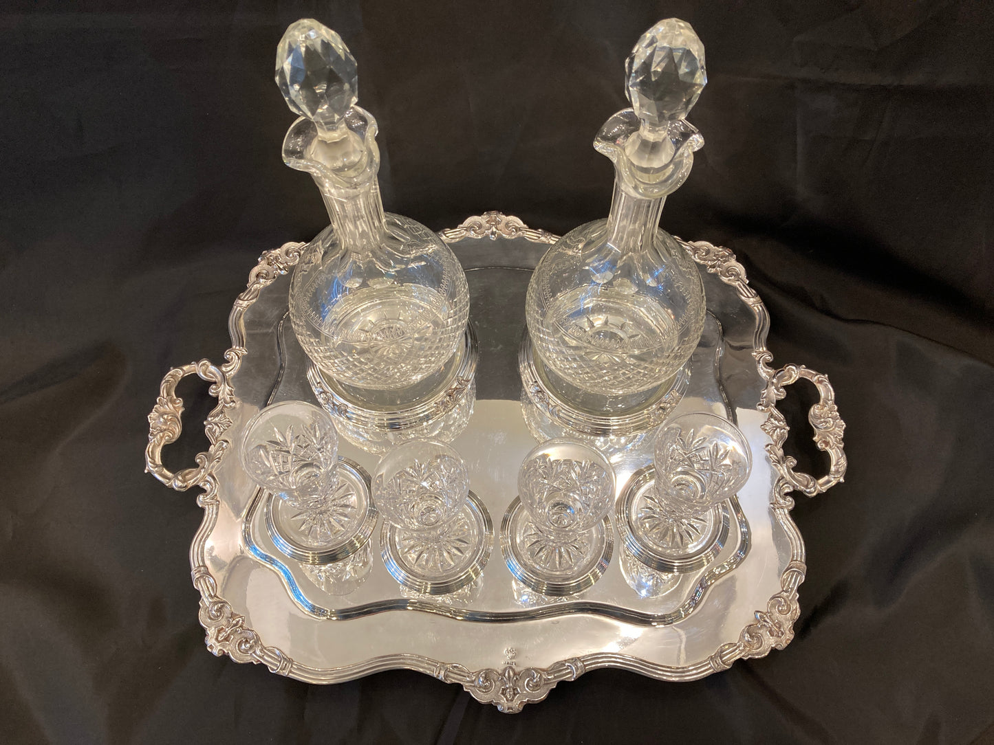 Antique silver plated drinks tray with cut crystal bottles and glasses