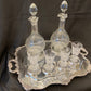 Antique silver plated drinks tray with cut crystal bottles and glasses