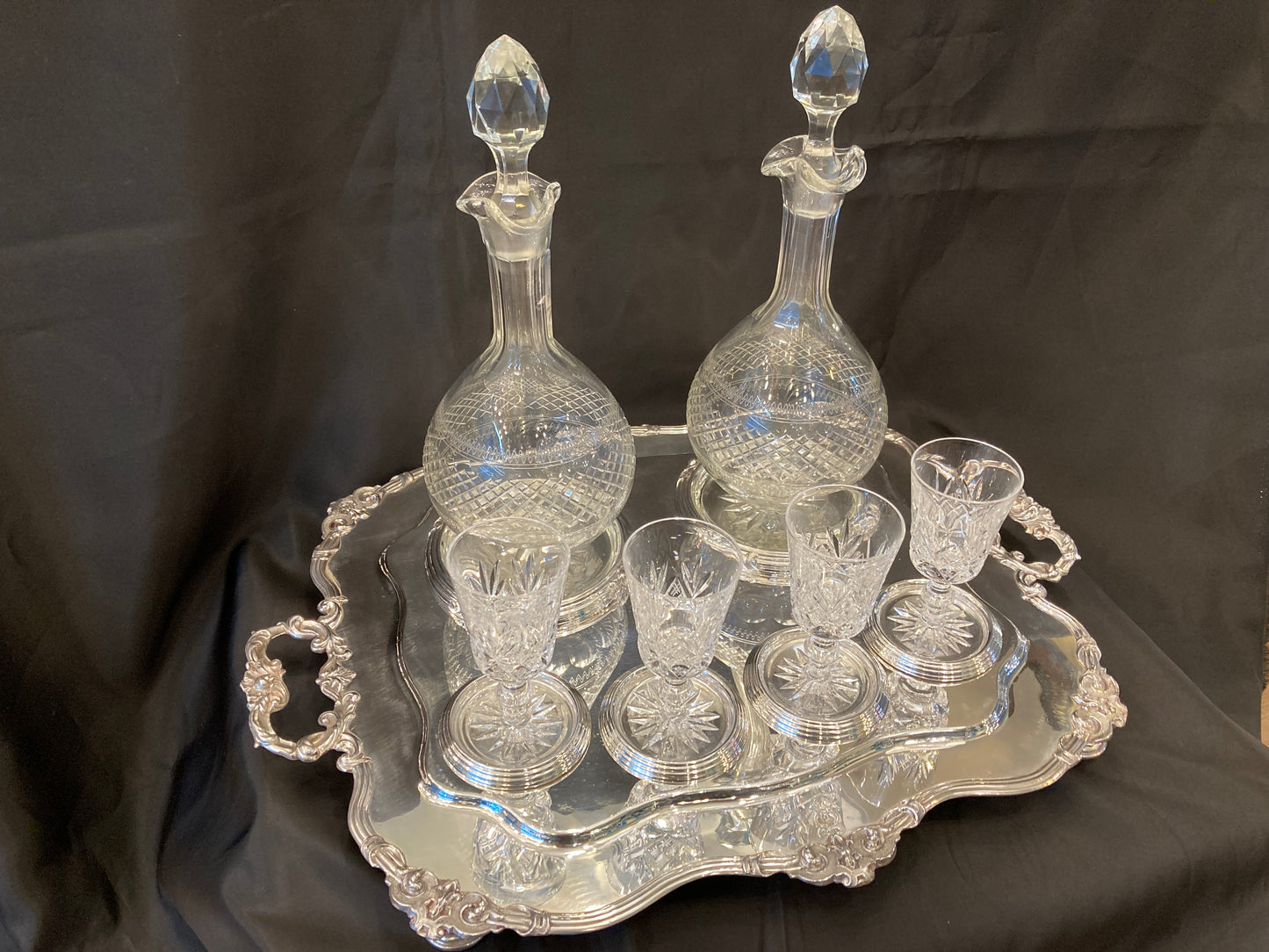 Antique silver plated drinks tray with cut crystal bottles and glasses